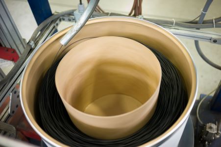Wire stored in a large drum